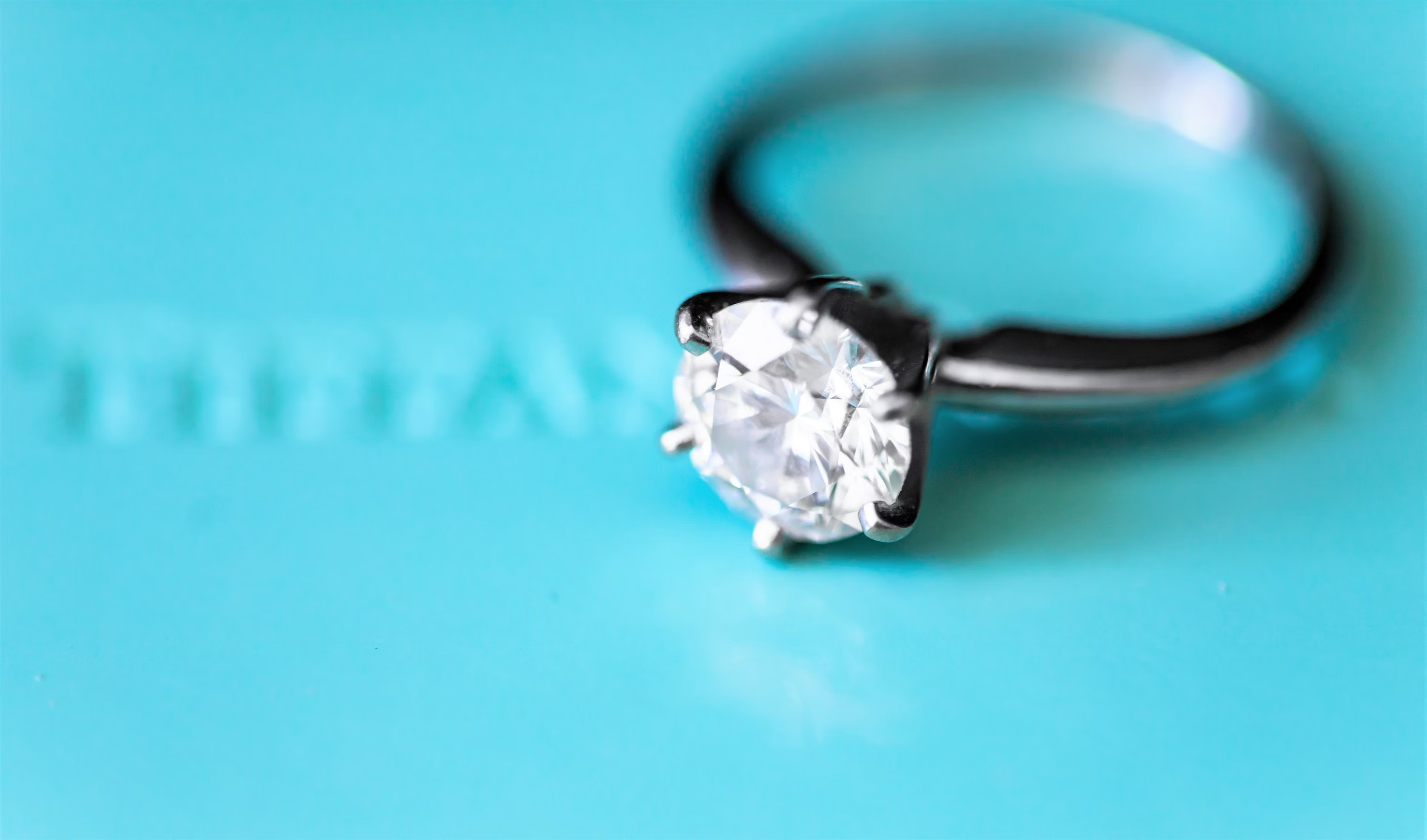 Tiffany diamond solitaire ring on blue background